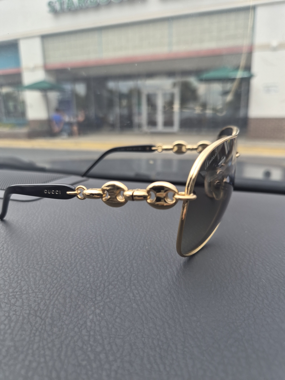 Gucci Black and Gold Aviator Sunglasses with Signature Chain Detail
